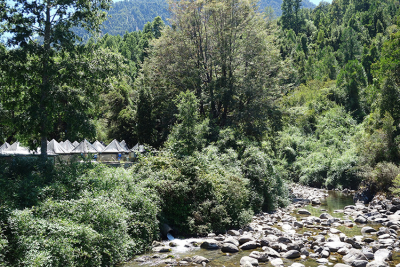 Salmon aquaculture on Río Niltre, a small river in Chile. The youngest generation of salmon is bred here. The waste water is conducted into the river through a pipe (centre of picture). Photo: Norbert Kamjunke