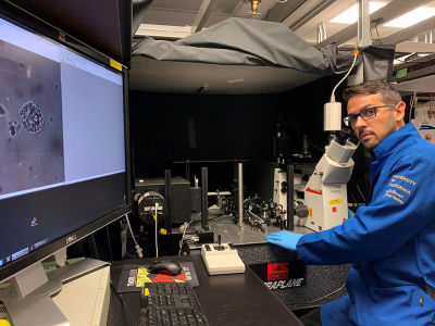 Marcos A.S. de Oliveira, first author of the paper, uses a line-scan Raman microscope to rapidly acquire Raman signals from the entire cell volume. This approach more accurately captures the chemical composition of an entire cell. Credit: Marcos A.S. de Oliveira, University of California, Davis