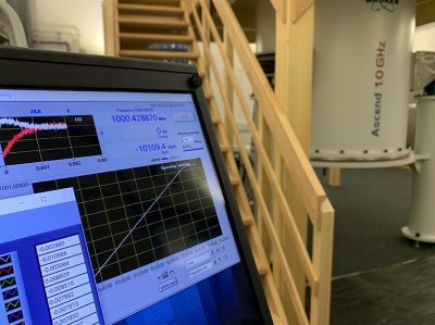 Console display showing the new NMR spectrometer (in the background) generating a 1 GHz magnetic field.