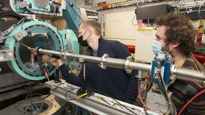 Andrej Singer, assistant professor of materials science and engineering (left), and graduate student Daniel Weinstock conduct an experiment at the Cornell High Energy Synchrotron Source.